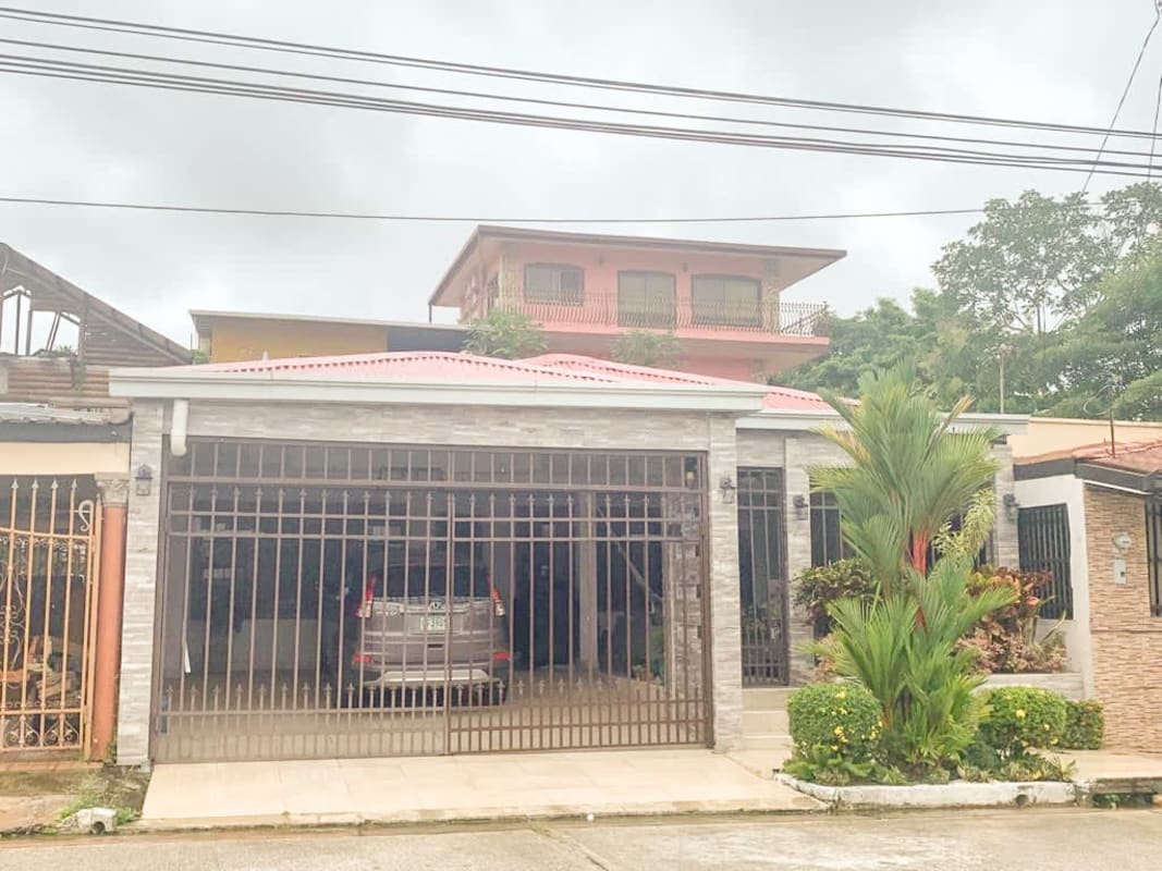 Single-story contemporary house with secure gate, tiled driveway and small garden San Antonio Panama