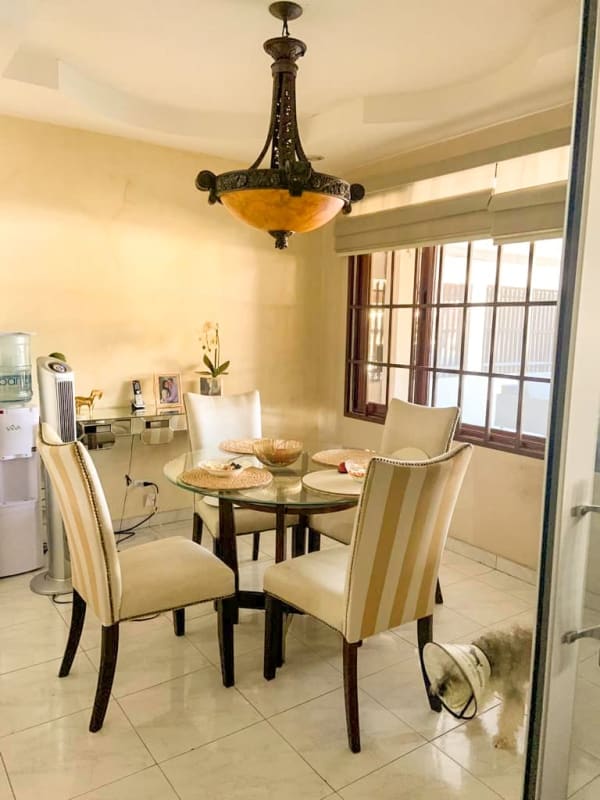 Front of house with stone facade, secure gate, and landscaped planter in Cerro Viento Panama City