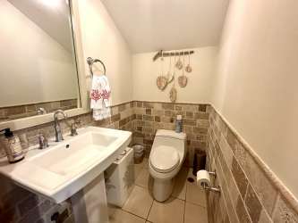 Open concept living and dining space with marble floors in luxury Buenaventura condo