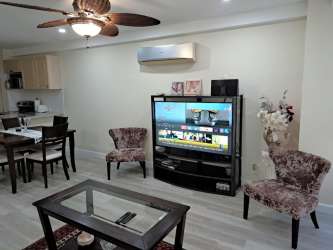 Spacious master bedroom with large window overlooking ocean, AC, ceiling fan in PH Coronado Bay