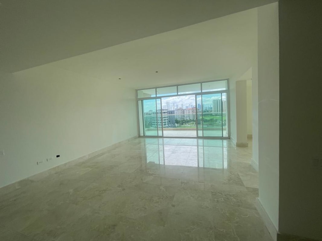 Dining area with elegant marble floors and large windows in Santa Maria Golf Panama apartment