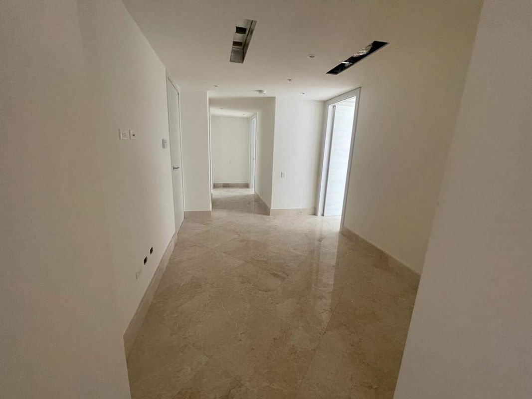 Covered outdoor patio with polished tiles lounge area Santa María Golf Panama