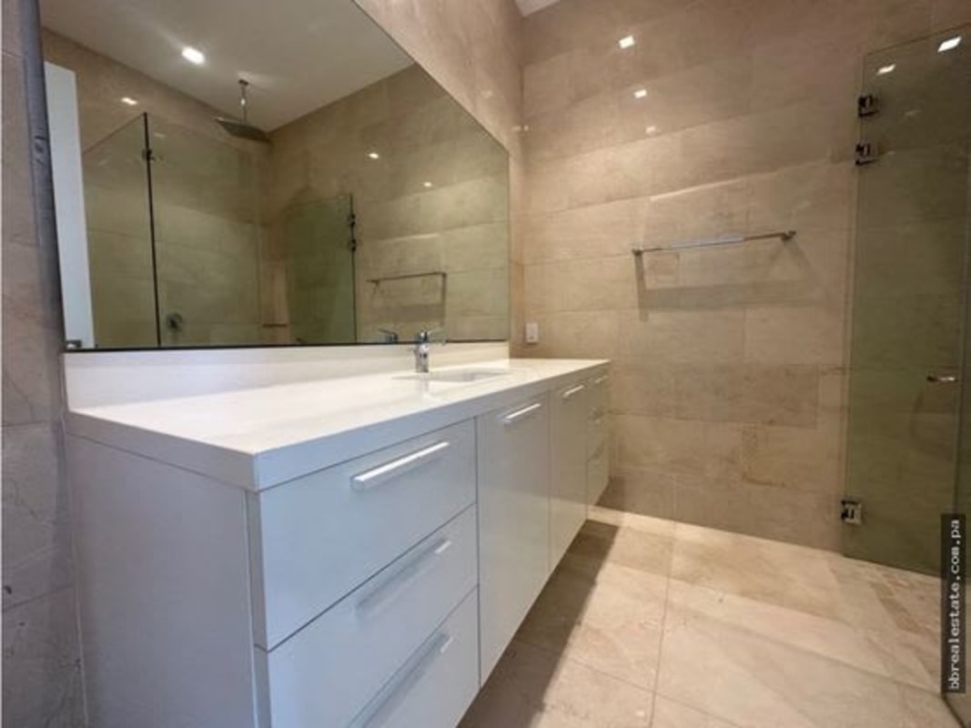 Expansive living room with marble flooring and high ceilings PH Garden Apartments