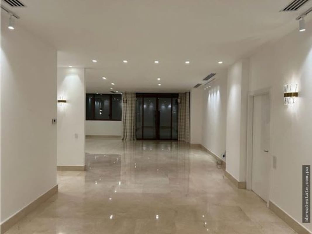 Elegant modern living dining space with marble floor recessed lighting in PH Garden Apartments Ocean Reef