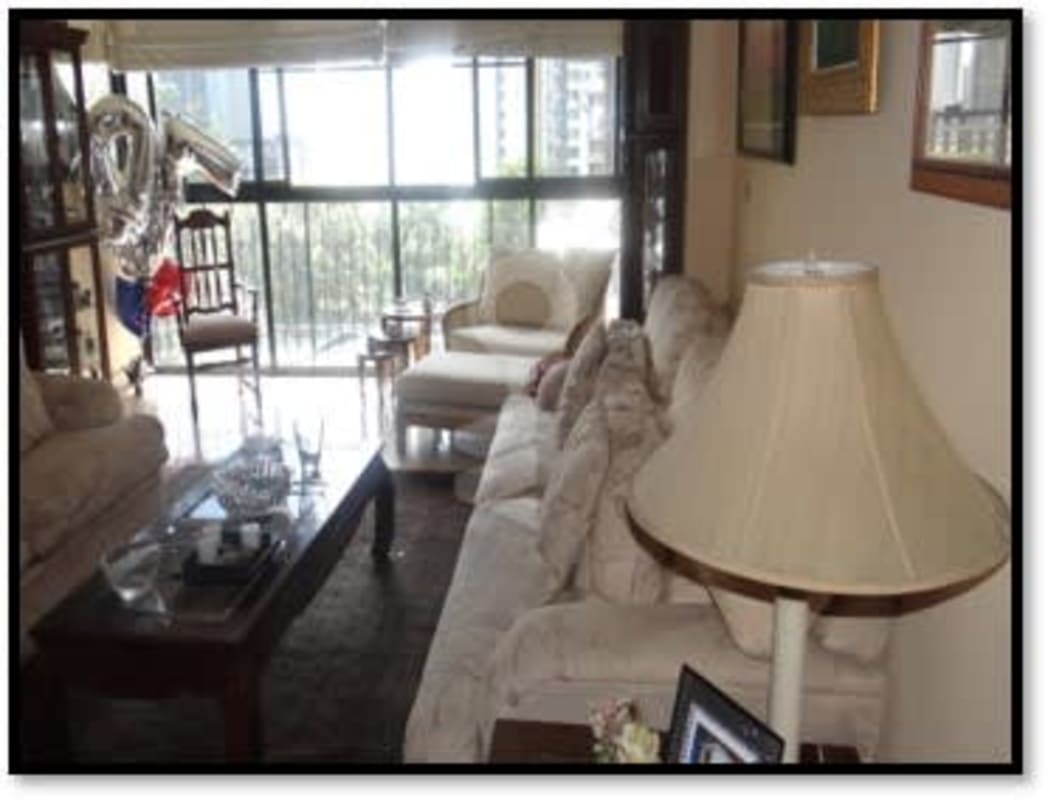 Living room with large windows, sofa, armchairs, balcony access PH Setton 32