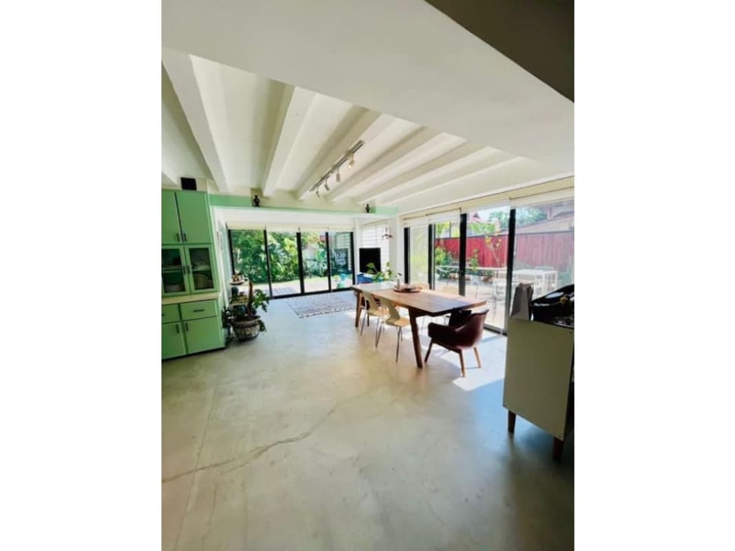 Large open-plan living dining area with high ceilings, natural light in house Albrook Panama City