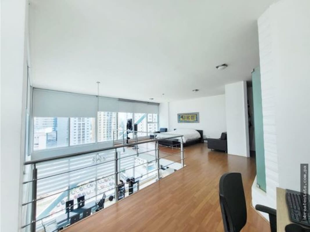 Loft bedroom and home office area with city views, wooden flooring in PH Loft Four 41 Punta Pacifica Panama