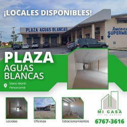 Interior empty commercial space with tiled floors white walls glass door Penonomé