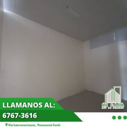 Minimalist bathroom with handrails tiled wall in retail unit Penonomé Coclé