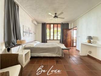 Traditional kitchen with wooden cabinets terracotta tiles window beach villa Panama