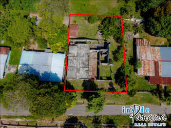 Property lot outlined with partially constructed building in Bejuco-Chame offering hostel business opportunity Panama