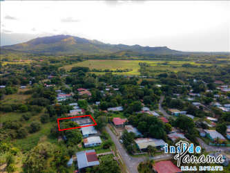 Neighborhood view with lot boundary of hostel project in Bejuco, green surroundings and nearby homes Panama