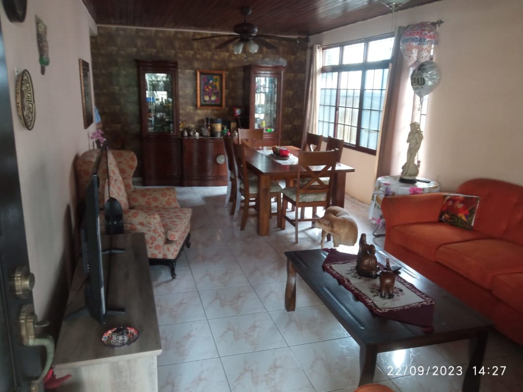 Bedroom with large window, tiled floor and wardrobe at house in San Francisco Panama for sale