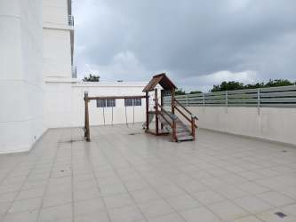 Bedroom with balcony access, ocean views, AC, and queen bed in Playa Corona Panama apartment