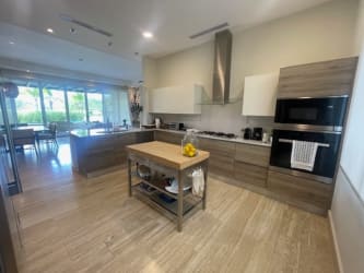 Bright bedroom with large window wood floors Buenaventura Peninsula villa Panama