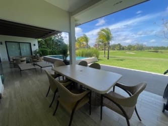 Patio with dining set overlooking swimming pool and golf course Buenaventura Peninsula Panama