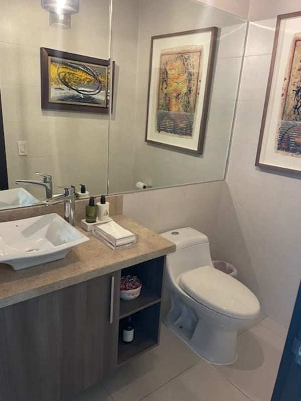 Bathroom with double sink vanity, granite counter, modern fixtures in PH Bali Costa del Este Panama