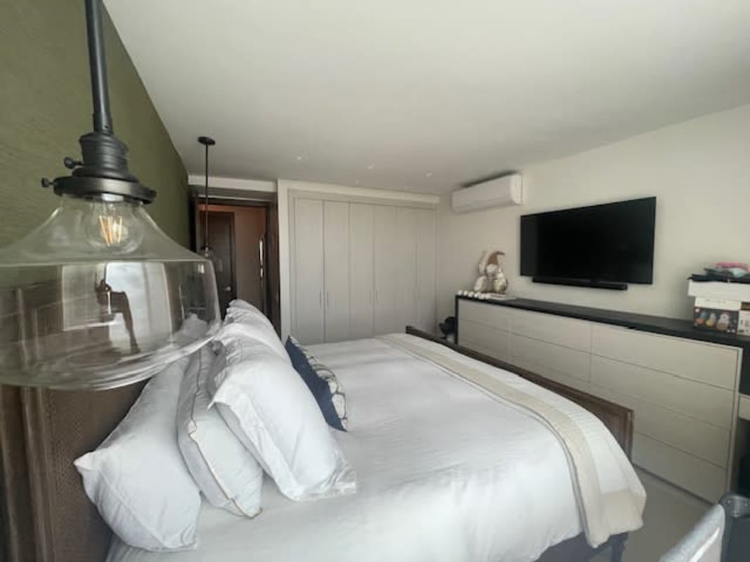 Luxury master bedroom with large window and Pacific ocean views in PH Bali Panama