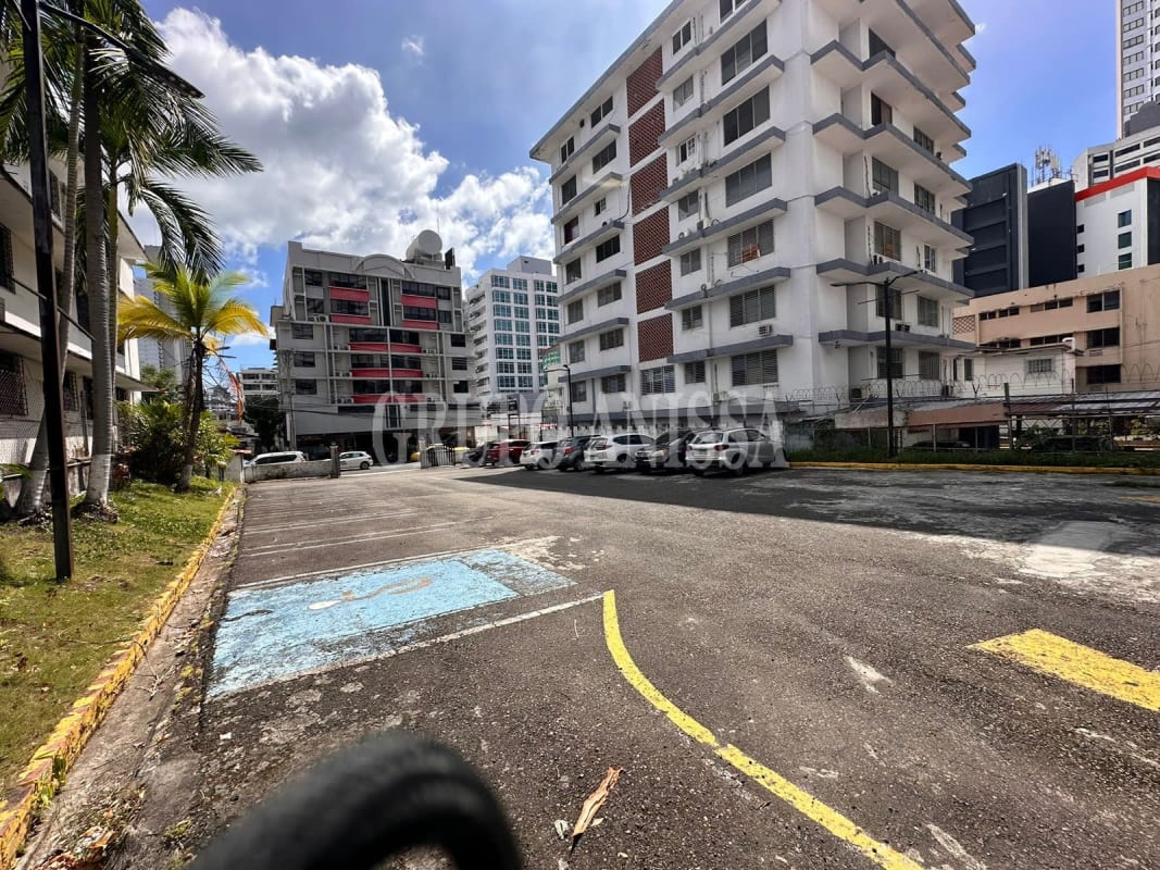 Flat paved parking lot with office building in El Cangrejo Panama commercial property for redevelopment