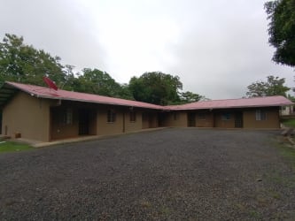 One-story apartment complex with parking, metal roof and garden in David Panama