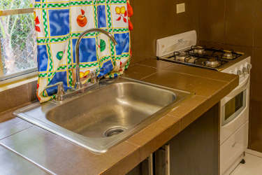 Large fenced green garden yard and water tanks Residencial David apartments David Panama