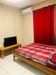 Open plan living and dining with sofa, curtains, air conditioning in Residencial David Chiriquí