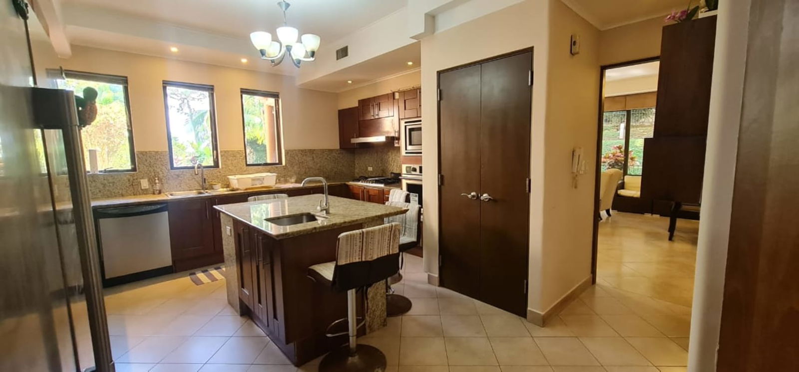 Spacious bathroom with double sink, large mirror, walk-in shower at Embassy Club Panama