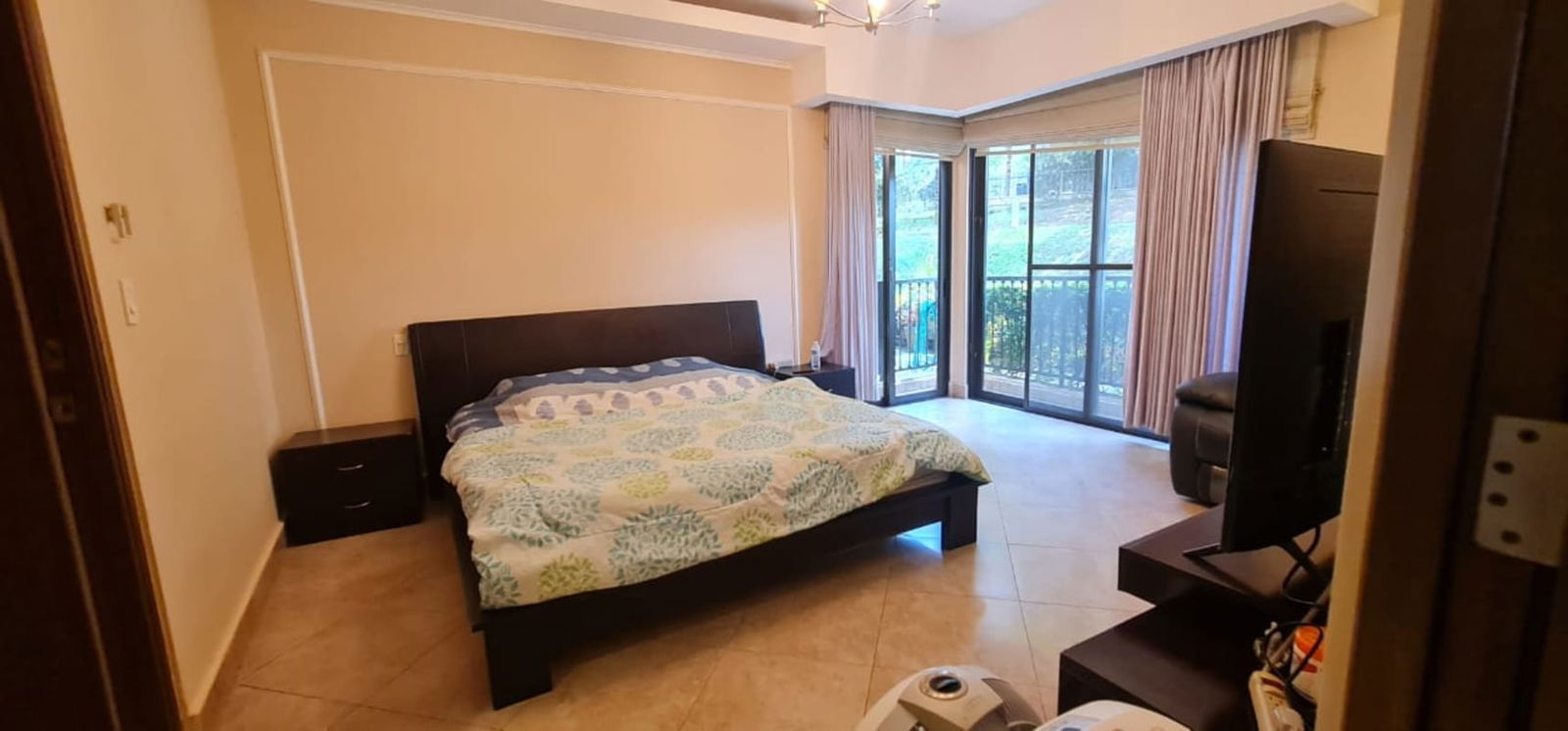 Spacious living dining room with large sliding doors onto garden terrace Embassy Club