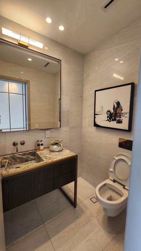 Elegant dining with large windows, modern chandelier and golf views at La Maison by Fendi Casa Panama