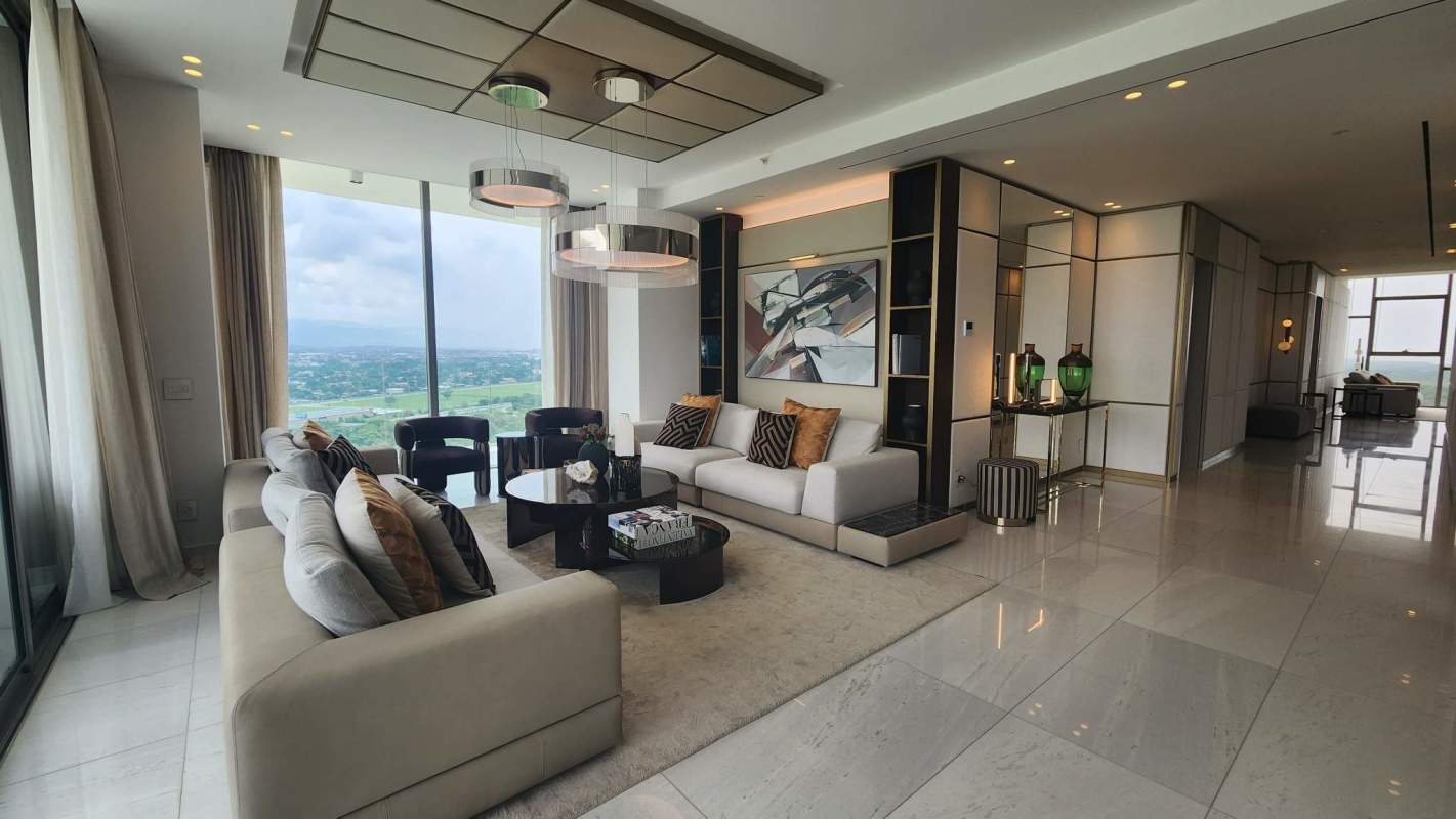 Stylish bathroom with marble countertop and large mirror at La Maison by Fendi Panama City