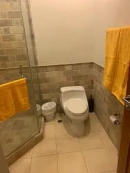 Patio overlooking lake with pergola and sun loungers Buenaventura Panama