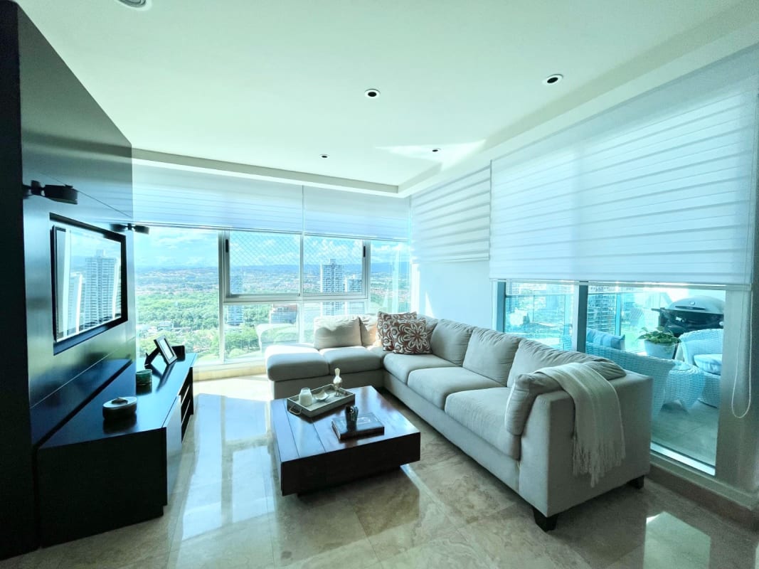 Open bright living dining area with marble floors, balcony access, city view in PH Mirador Costa del Este Panama