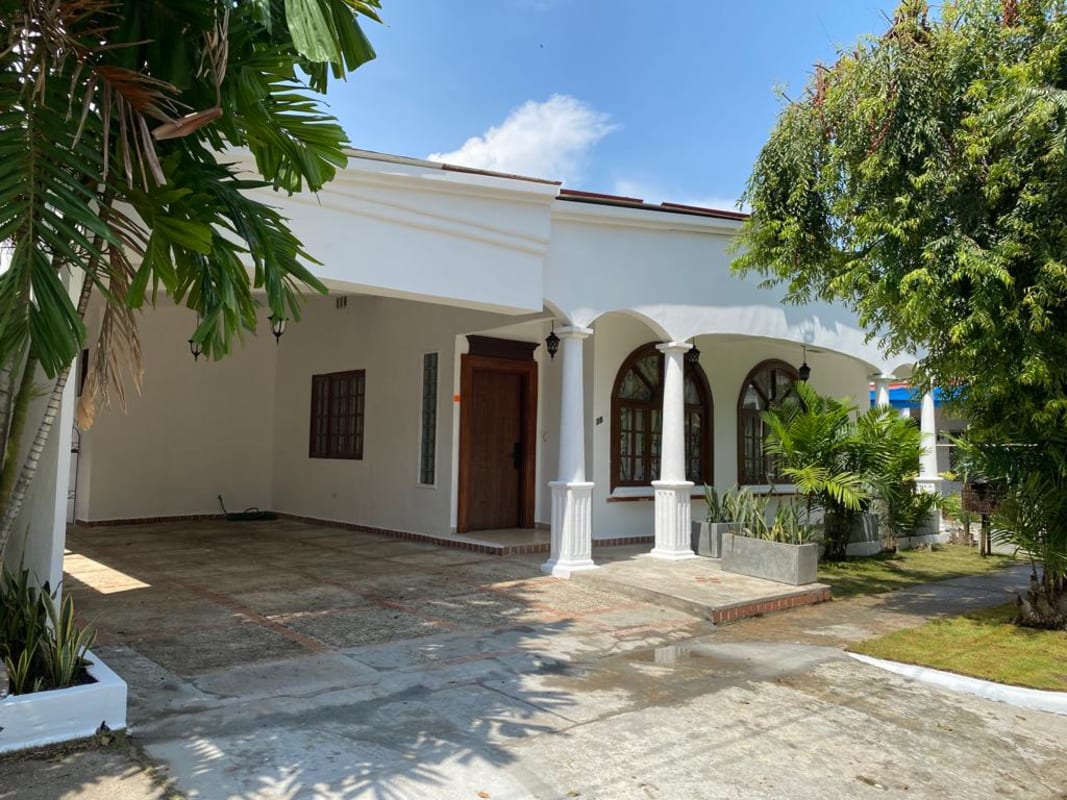 Large tiled porch with archways of colonial house for sale in Obarrio commercial zone Panama