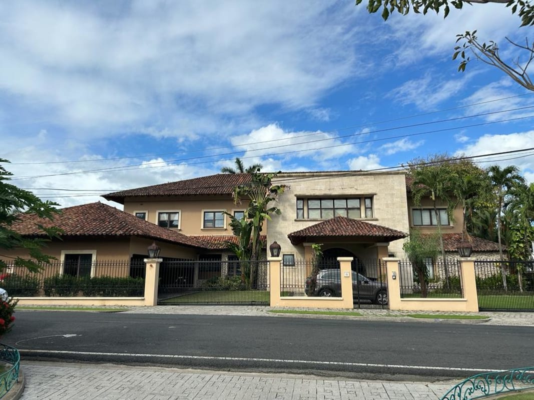 Elegant entry foyer with iron doors and marble staircase luxury home Altos del Golf Panama