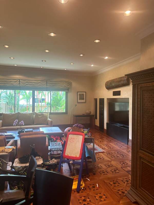 Large living room with custom media unit, garden view at Altos del Golf Panama