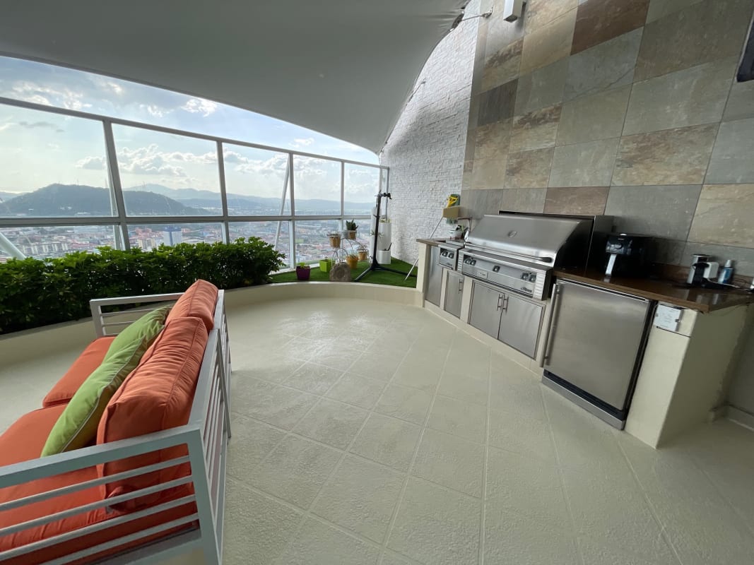 Contemporary kitchen with marble floors, luxury appliances, city view Yacht Club Tower Panama