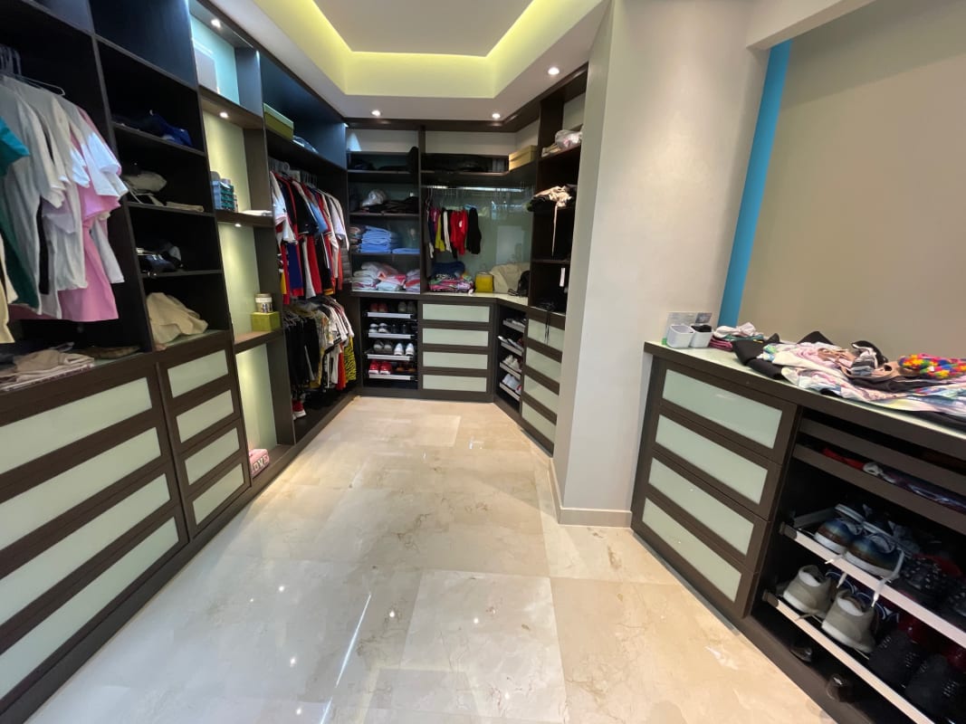 Spacious walk-in closet with custom fittings Yacht Club Tower Panama penthouse