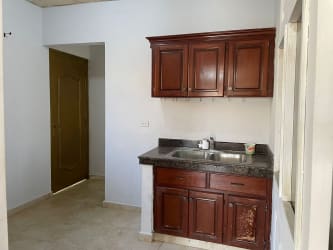 Bedroom with air conditioning, tile floors, natural light, and garden views Penonomé Panama