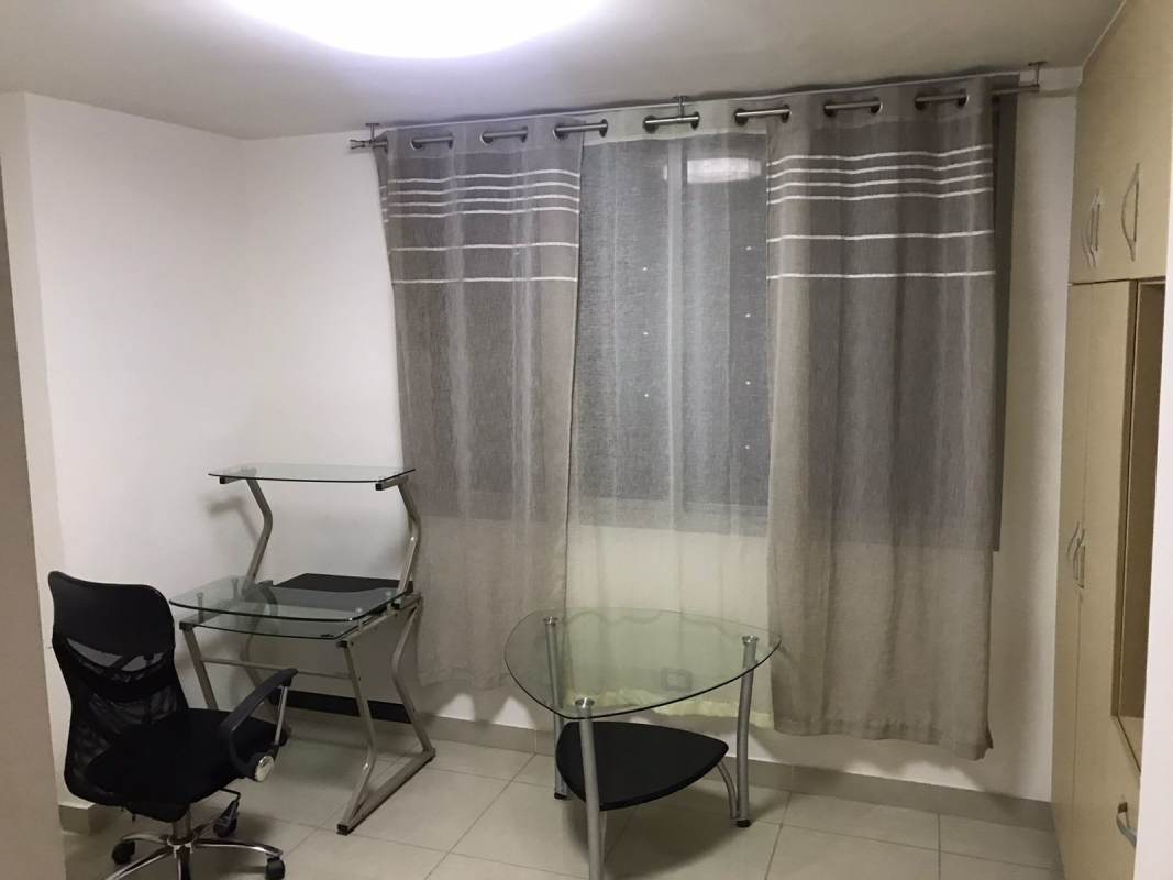 Minimalist study or office space with window and built-in cabinets PH Rokas Condado del Rey Panama