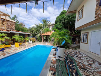 Rustic tropical two-story villa with balcony, gardens, and driveway Nueva Gorgona Panama