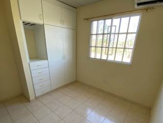 Bedroom with tiled floor and large window with security bars house for sale Penonomé Coclé