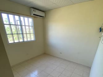 Second bedroom with tile floor natural light safety window Miraflores Penonomé Panama