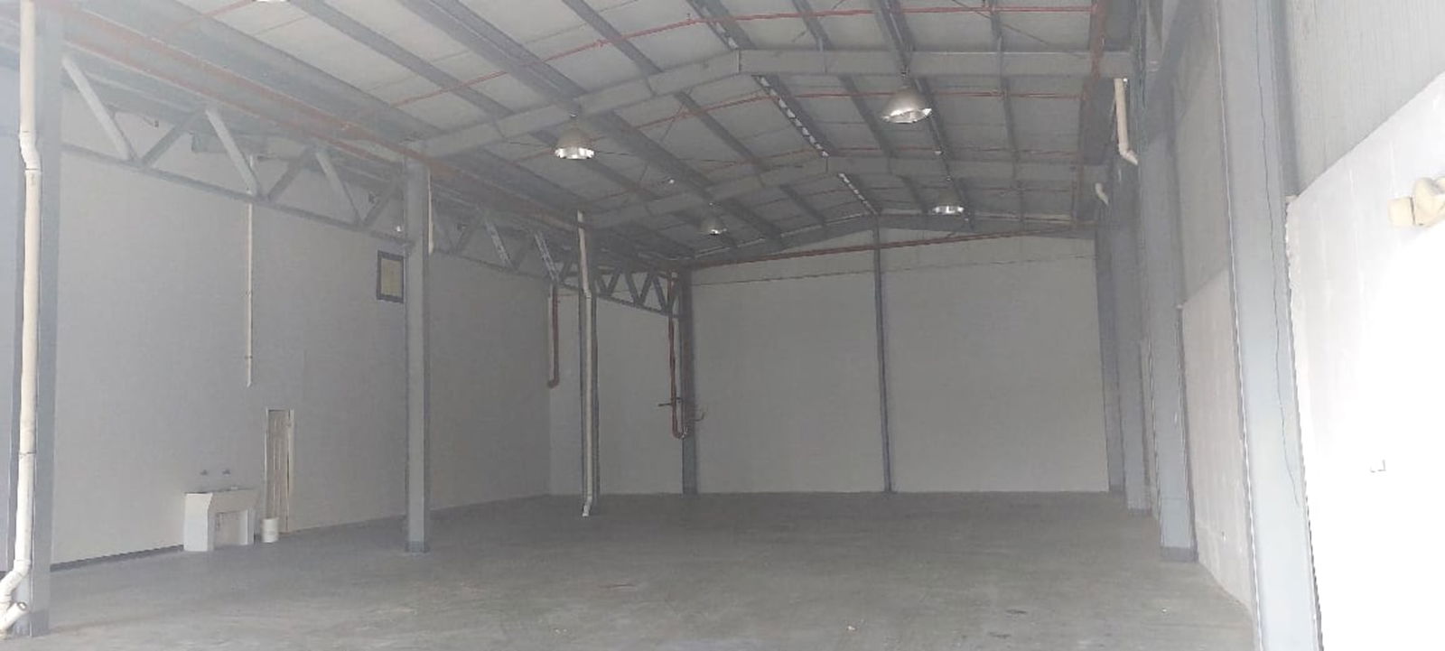 Interior of warehouse with exposed beams concrete floors high clearance Panama City