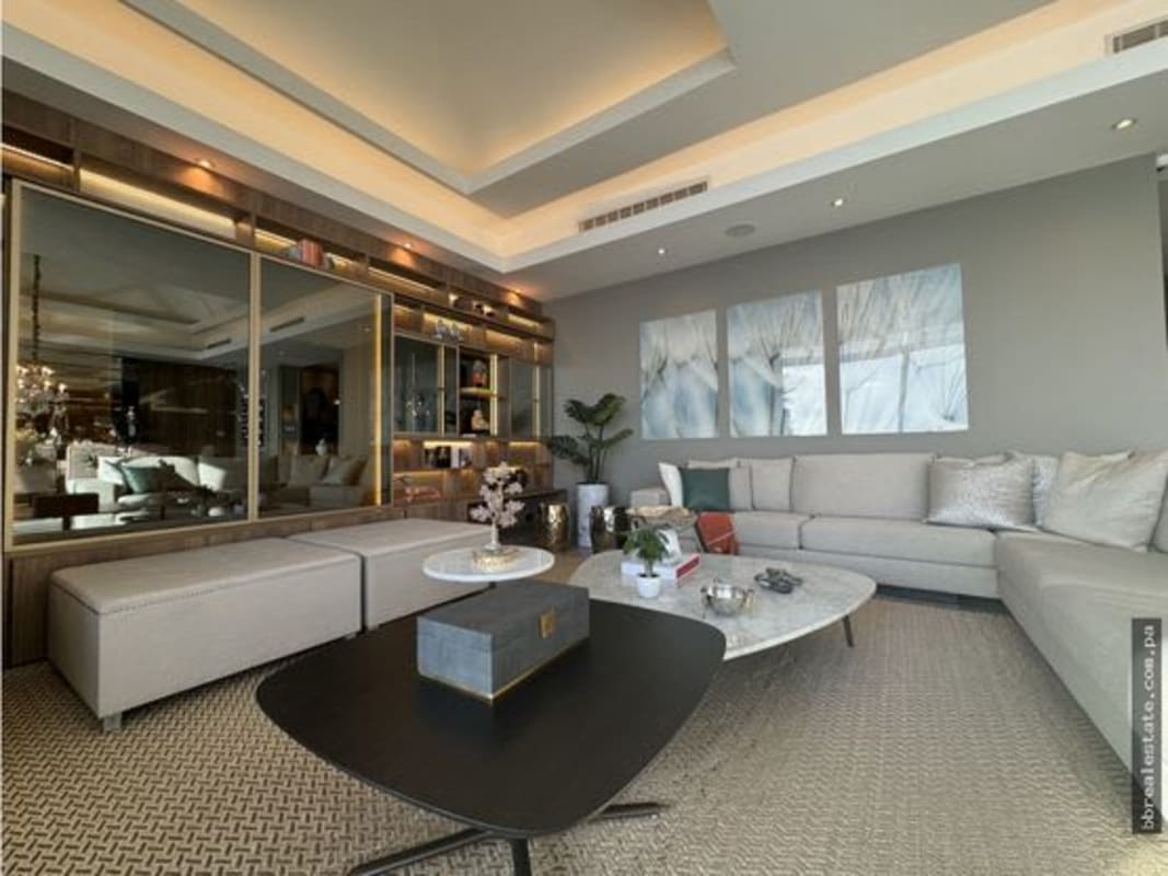 Modern laundry room with large windows, cabinets, hanging rods in duplex penthouse Costa del Este