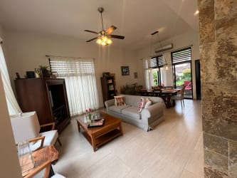 Spacious kitchen with granite countertops, wood cabinets and stainless appliances in PH Nativa house