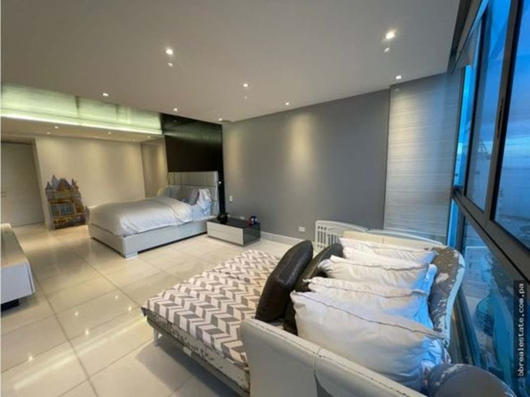 Penthouse master suite with balcony and city ocean views at PH Aqualina Panama