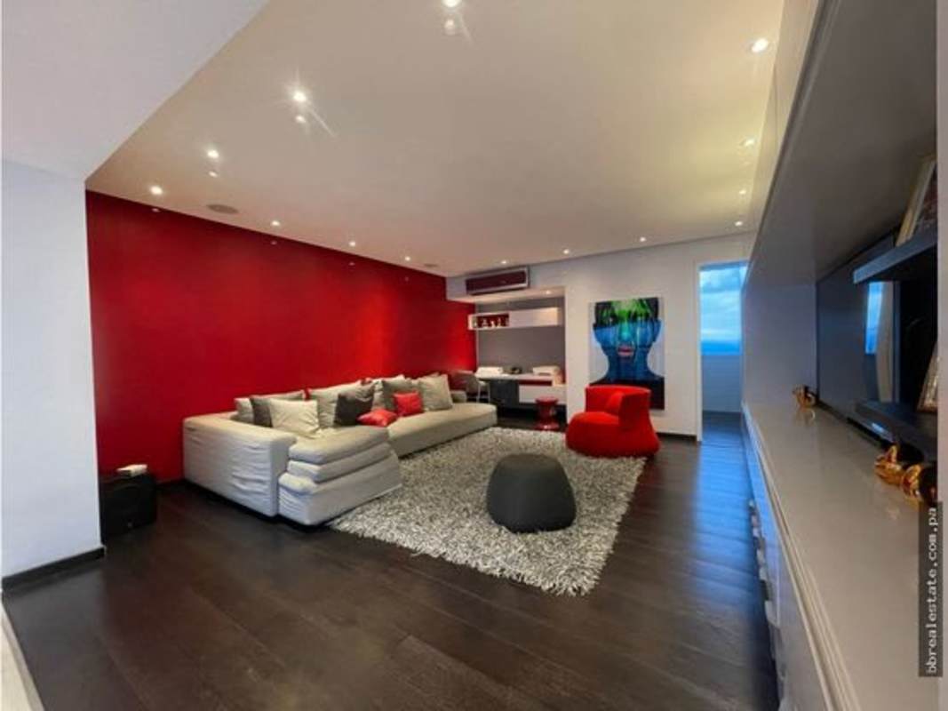 Spacious living room with floor-to-ceiling windows and ocean view in PH Aqualina Penthouse Panama