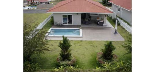 One-story villa with pool, garden, patio seating at Villas del María in Bejuco Panama
