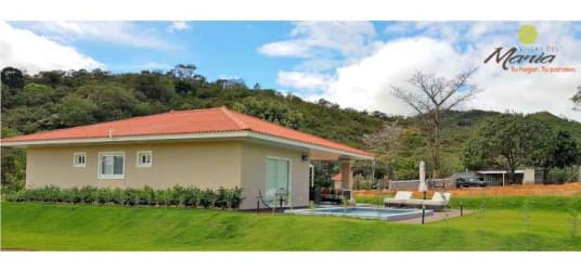 Single-story beige house with red roof, private pool, mountain views at Villas del María Bejuco Panama