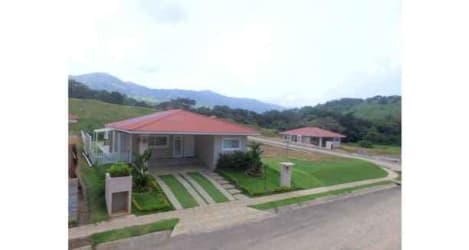 Single-story country house with lawn and tiled roof at Villas del María Bejuco Panama